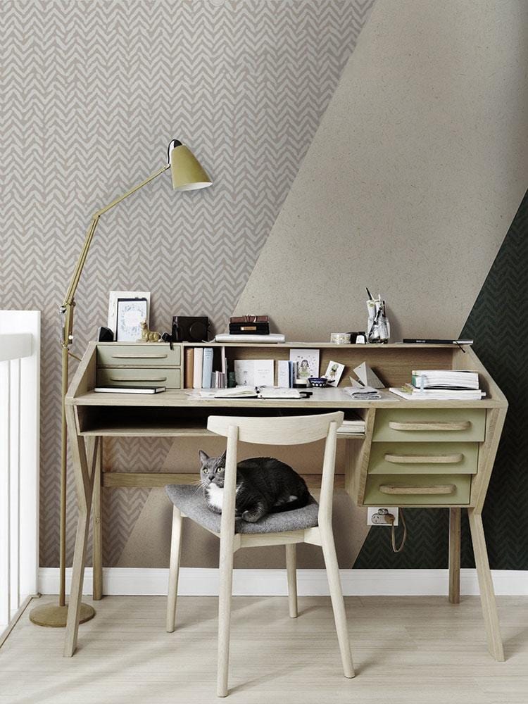 Modern Geometric Green and Grey Triangular Pattern Wallpaper with desk, chair, and gold floor lamp.