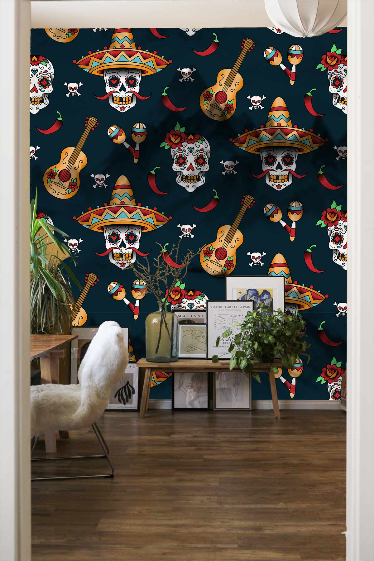 Vibrant wallpaper featuring Mexican skulls and guitars, cosy room, wooden flooring, white chair.