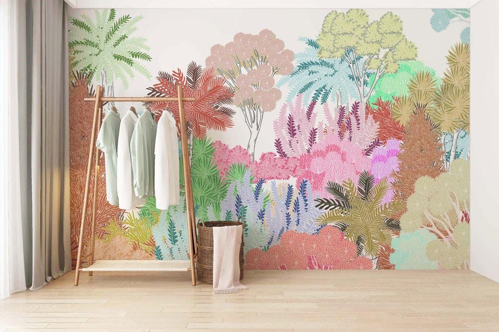 Colourful Tropical Jungle Botanical Mural Wallpaper with lush pastel design, light wood flooring, and clothes rack.