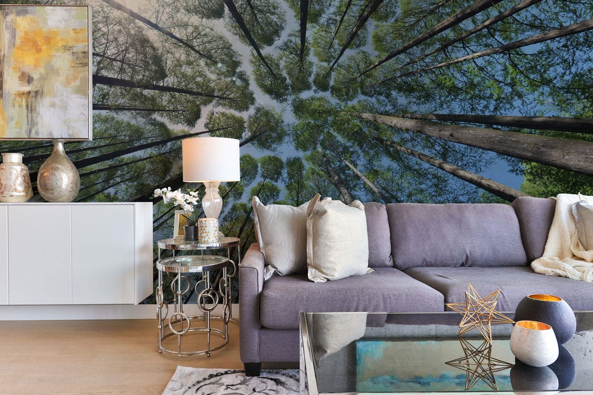 Forest Canopy Nature Mural in living room; grey sofa, white sideboard, abstract artwork, modern style.