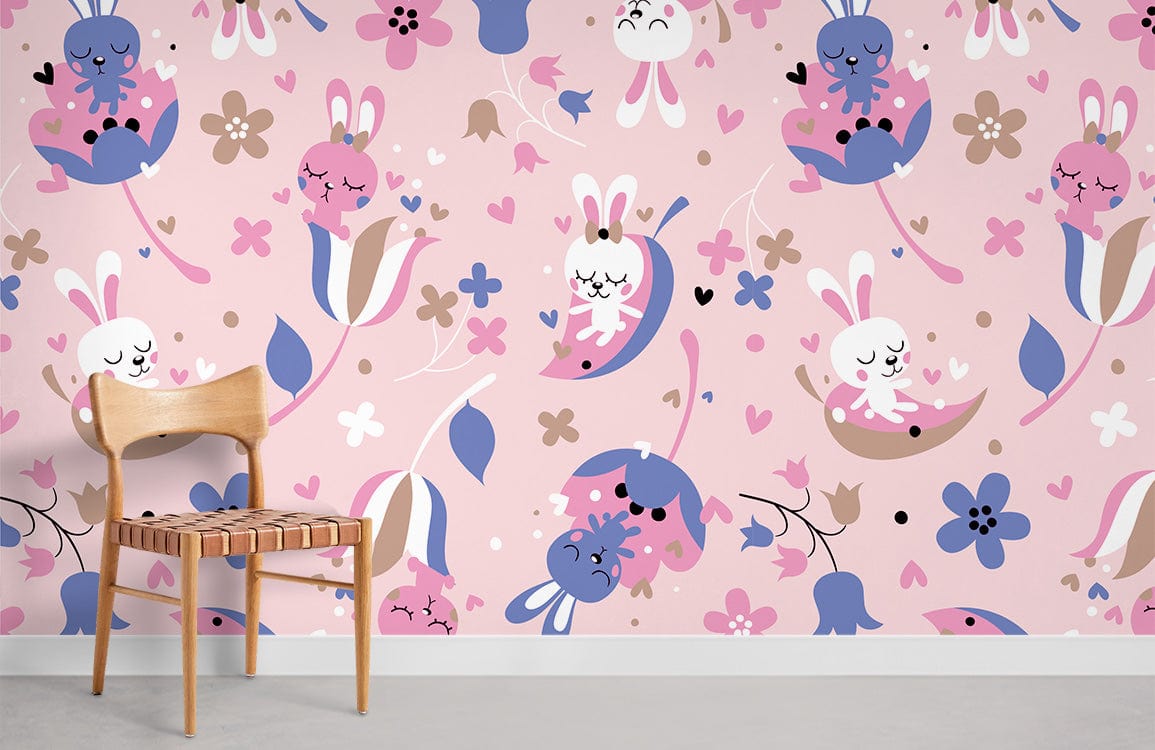 Pink whimsical bunny nursery wallpaper by Dreamy Pastel, featuring wooden chair on light grey floor.