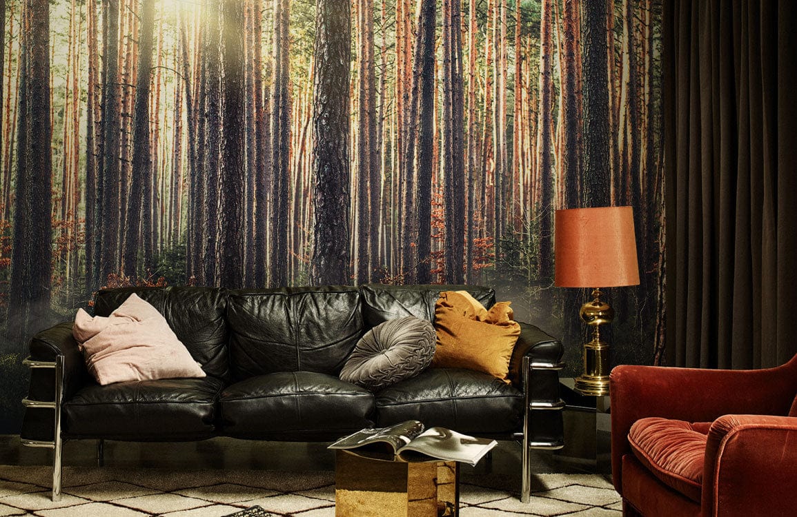 Sunlit Forest Mist Mural Wallpaper, lush nature decor, black leather sofa, vintage lamp, patterned rug.