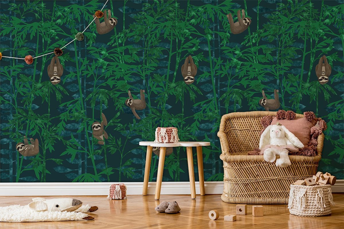Green jungle sloth pattern wallpaper in nursery with wicker chair, light wood flooring, playful decor.