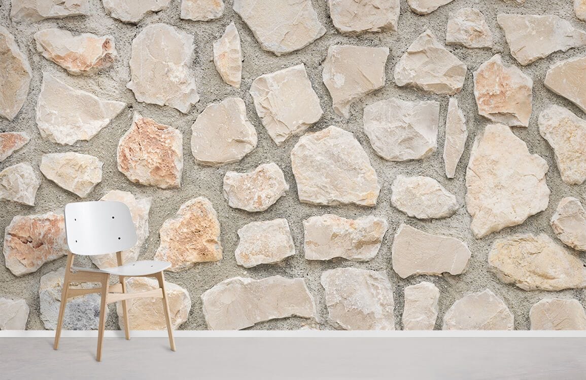 Beige and grey rustic stone effect wallpaper with modern white chair on light wood flooring.