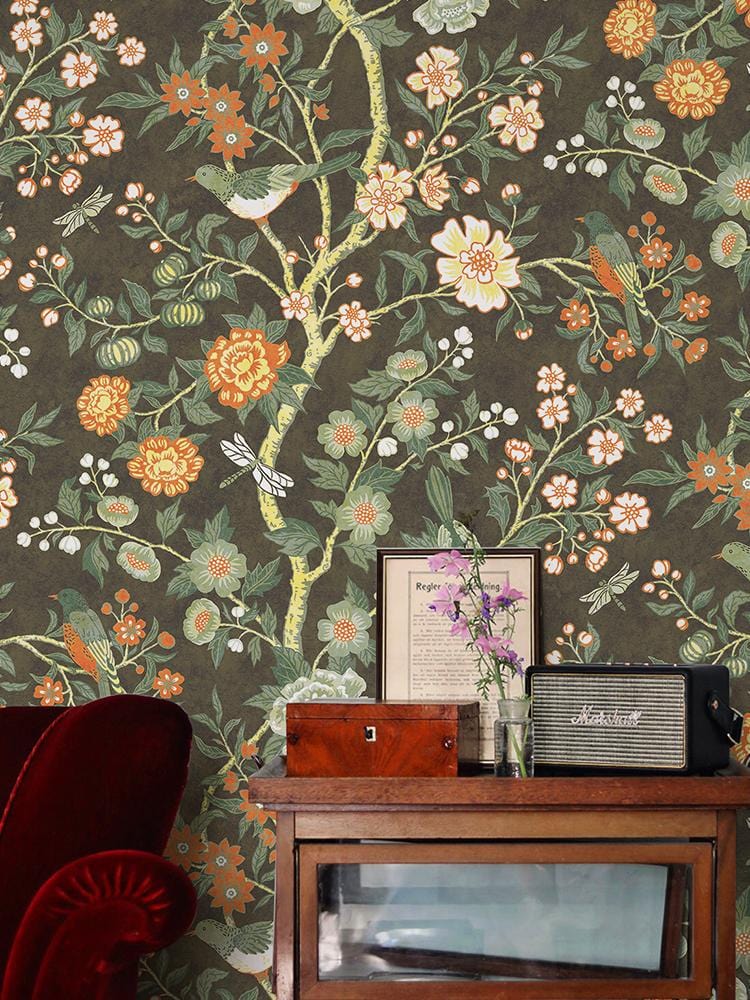 Vintage botanical floral wallpaper, dark earthy tones, Victorian style, red velvet sofa, with wooden console.