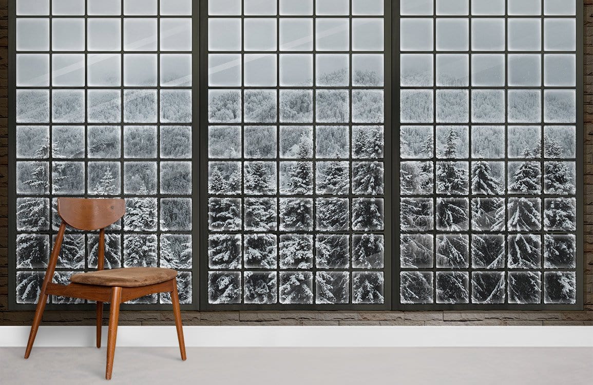 Panoramic Winter Wonderland Mural Wallpaper featuring snowy forest, wooden chair, neutral flooring, contemporary room.