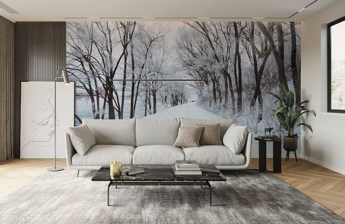Winter Wonderland Mural Wallpaper in living room with grey sofa, wooden flooring, and modern decor.