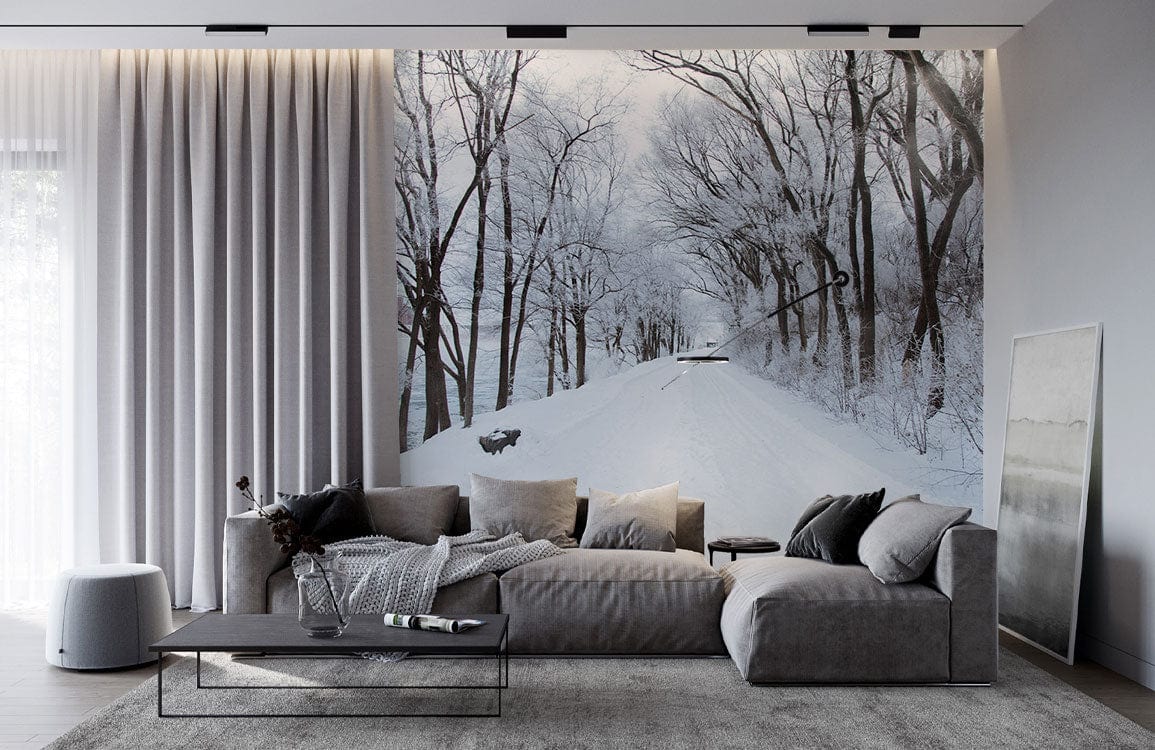 Luxurious living room with Winter Wonderland Snowy Tree Path Scenic Mural Wallpaper, grey sofa, modern flooring.