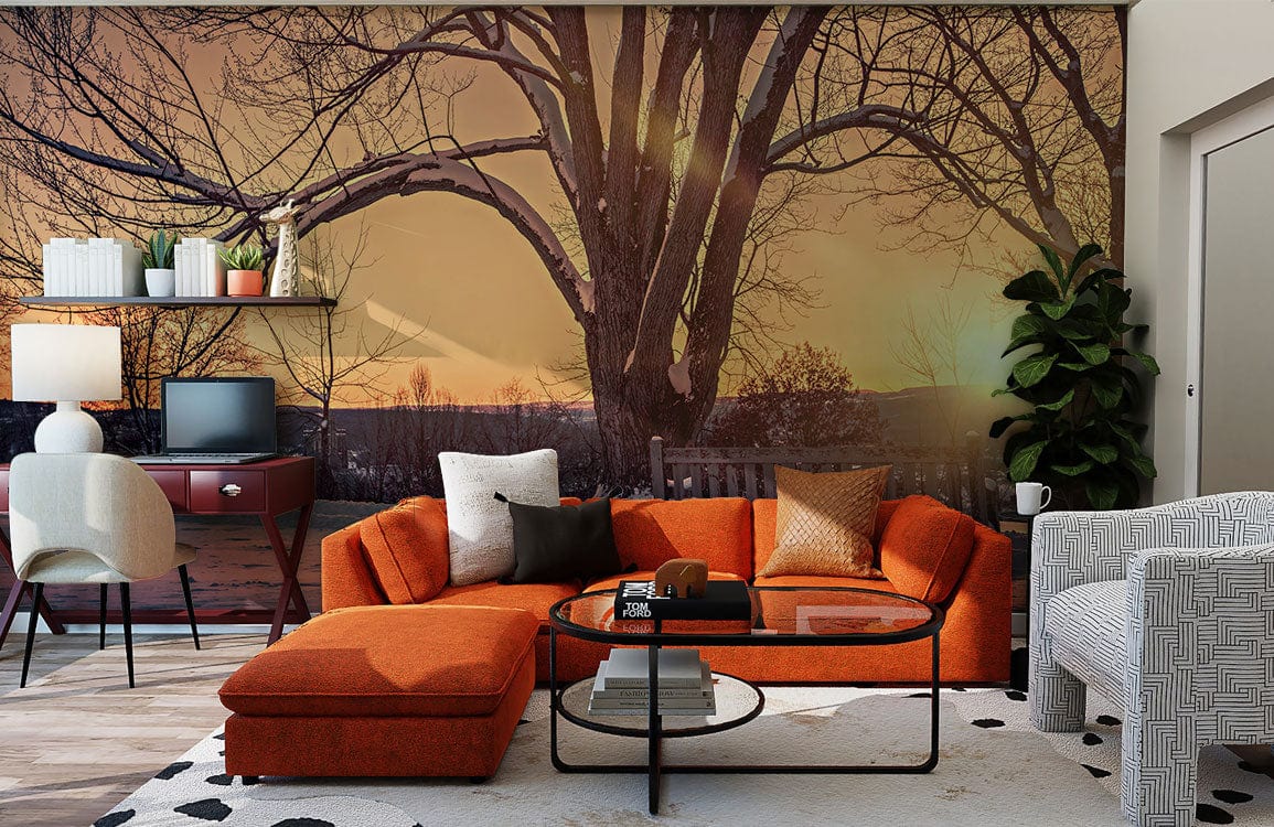 Serene Winter Sunset Mural Wallpaper with orange sofa, black coffee table in modern living room.