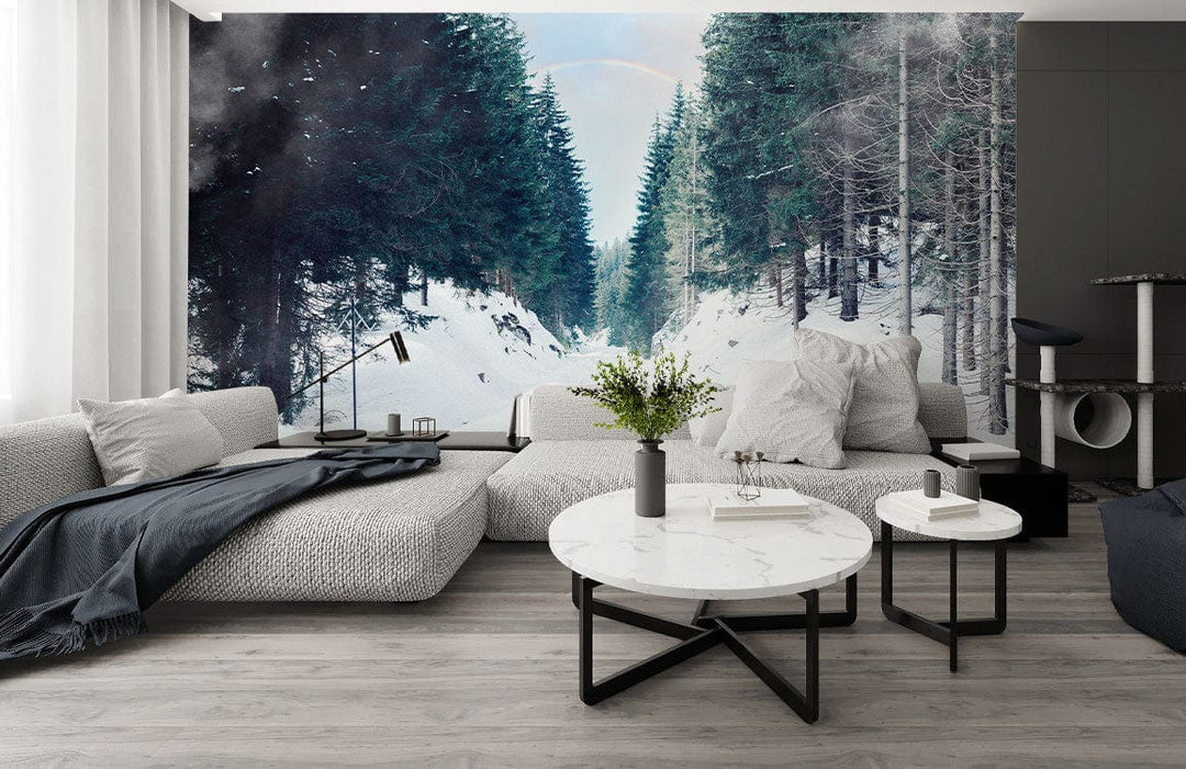 Serene Winter Forest Mural Wallpaper in modern living room with grey sectional sofa and marble tables.