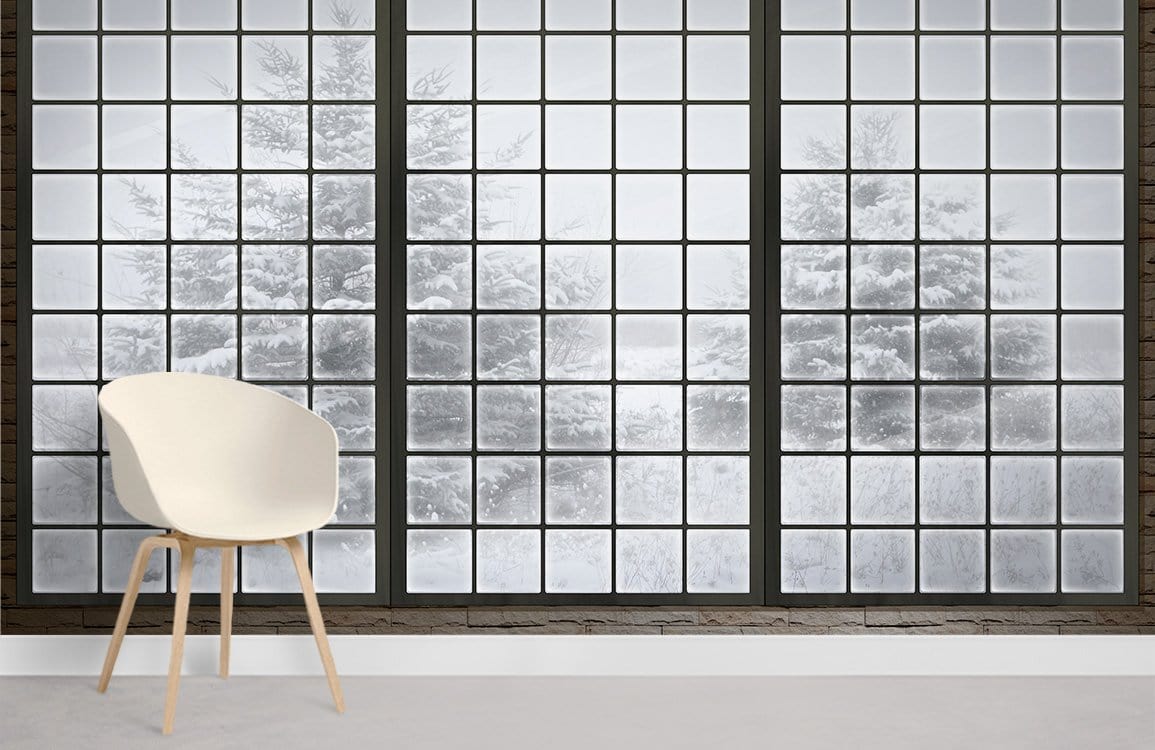 White chair with Frosted Winter Window Mural Wallpaper, tranquil snowy landscape, grey floor, minimalist decor.