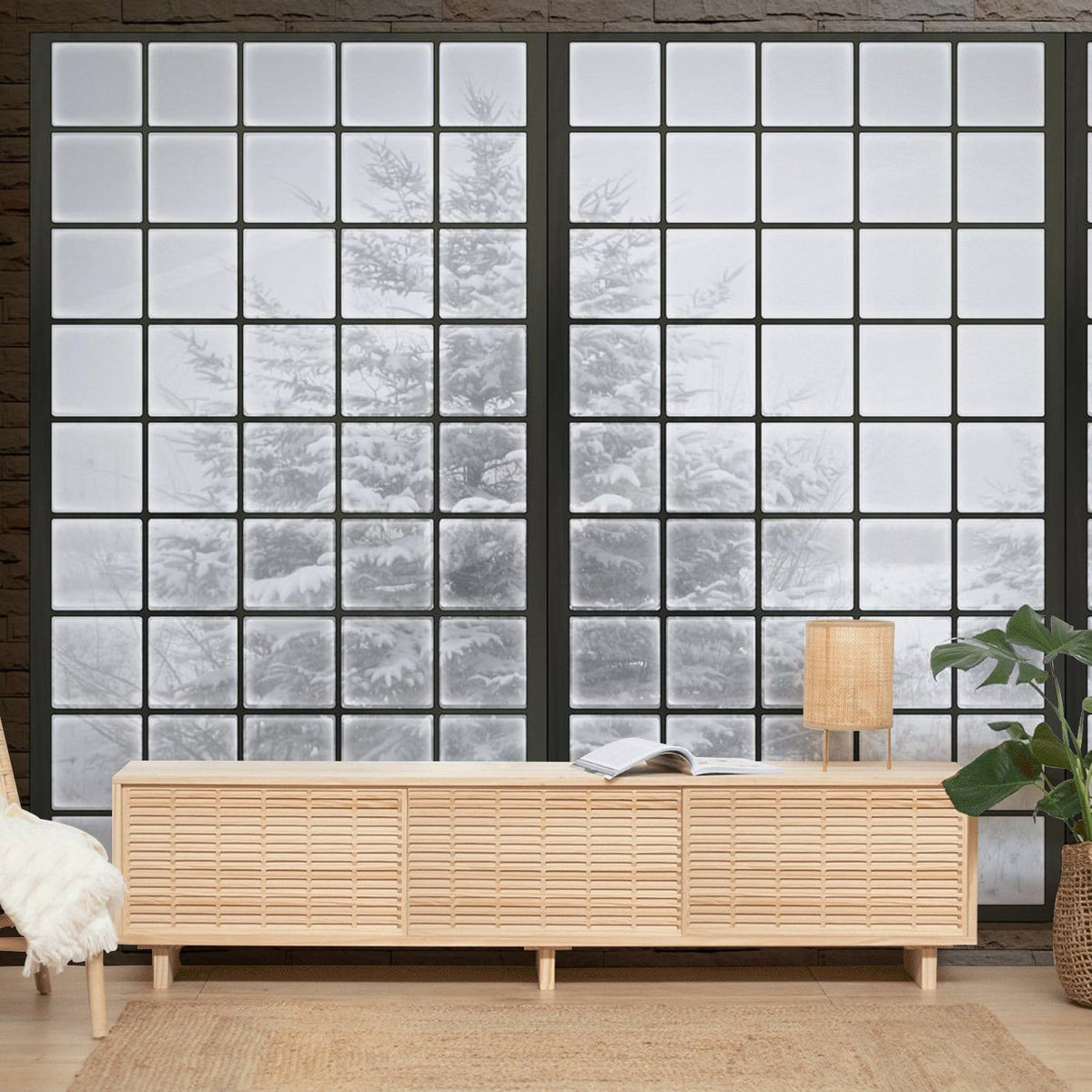 Frosted window mural wallpaper, snowy landscape, wooden sideboard, cosy rug, serene interior decor.