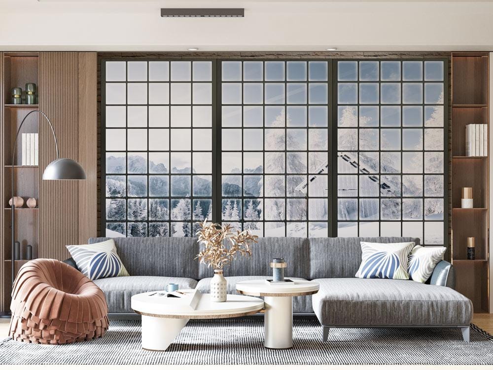 Winter Wonderland Snowy Mountain Mural Wallpaper in living room, featuring grey sofa, wood flooring, and decor.