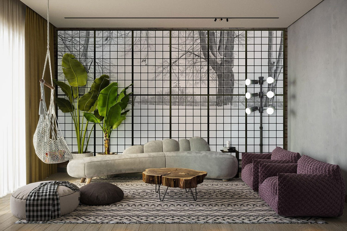 Panoramic winter landscape mural with grey sofa, patterned rug, wood table, and hanging chair in lounge.