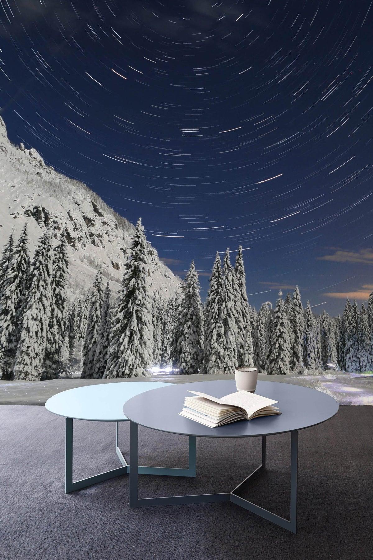 Enchanting Winter Night Sky mural wallpaper in modern living room with grey round tables.