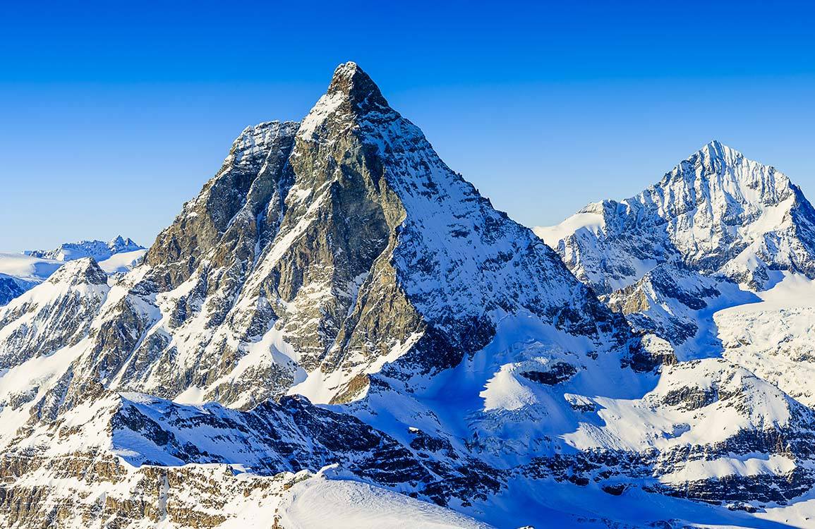 Stunning Alpine Mountain Landscape Mural Wallpaper in Serene Cool Tones
