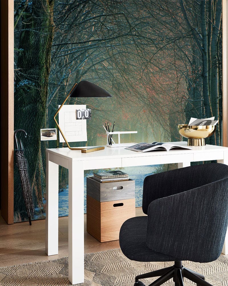 Enchanted Winter Forest Pathway Mural Wallpaper in modern office with white desk, black chair, stylish decor.