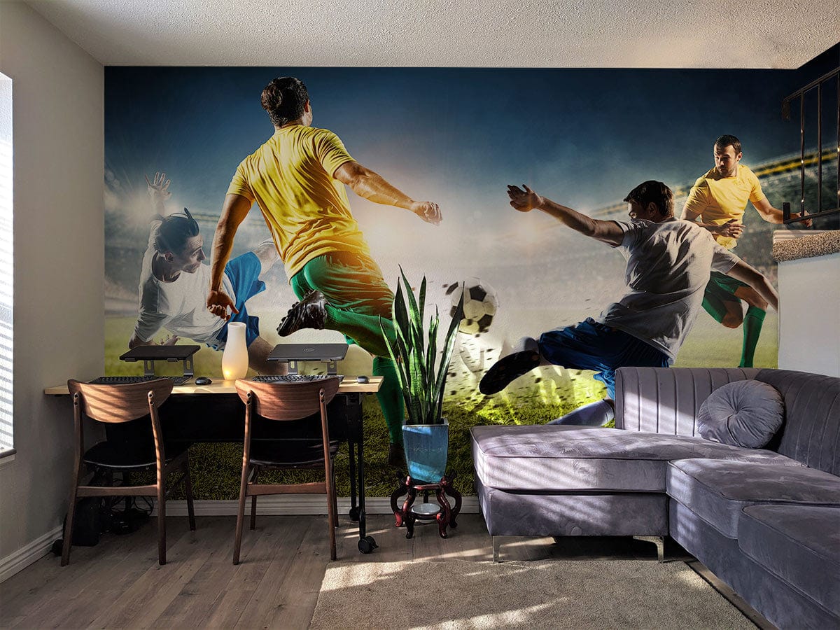Dynamic Football Match Mural Wallpaper in living room with grey corner sofa, desk, and light wood flooring.