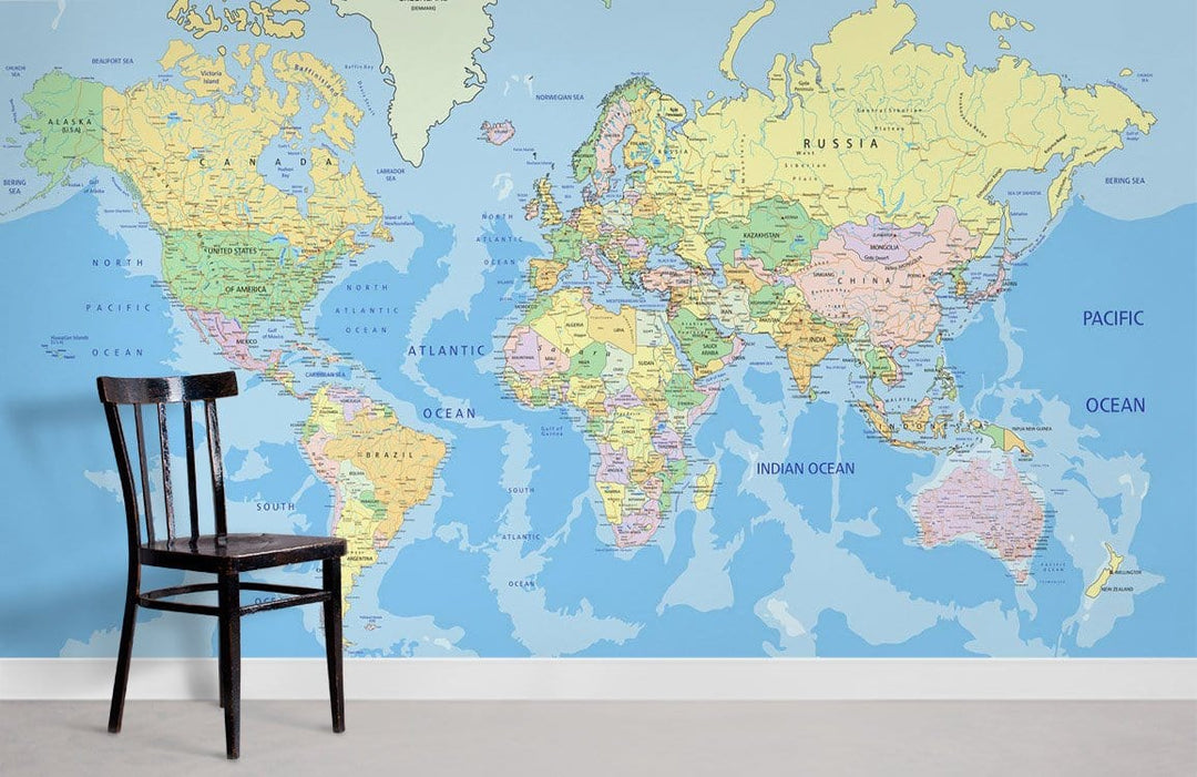 Alt text: Vintage World Map Mural Wallpaper, wooden chair, light grey flooring, spacious room setting.