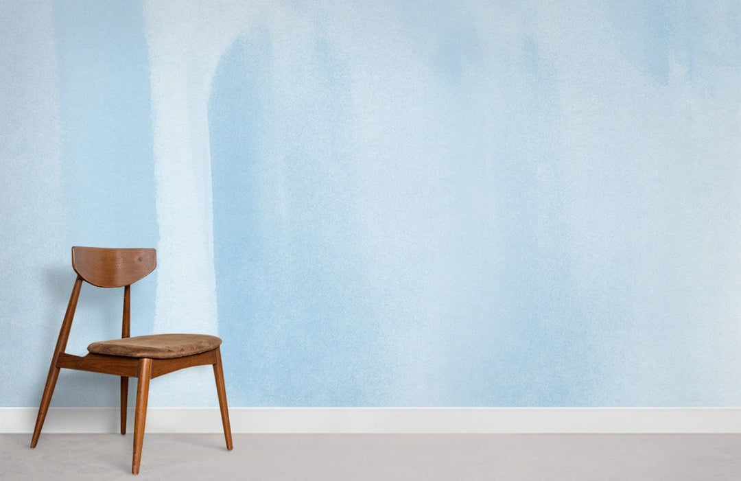 Sky blue watercolour effect wallpaper, wooden chair, minimalist decor, serene interior, light grey flooring.