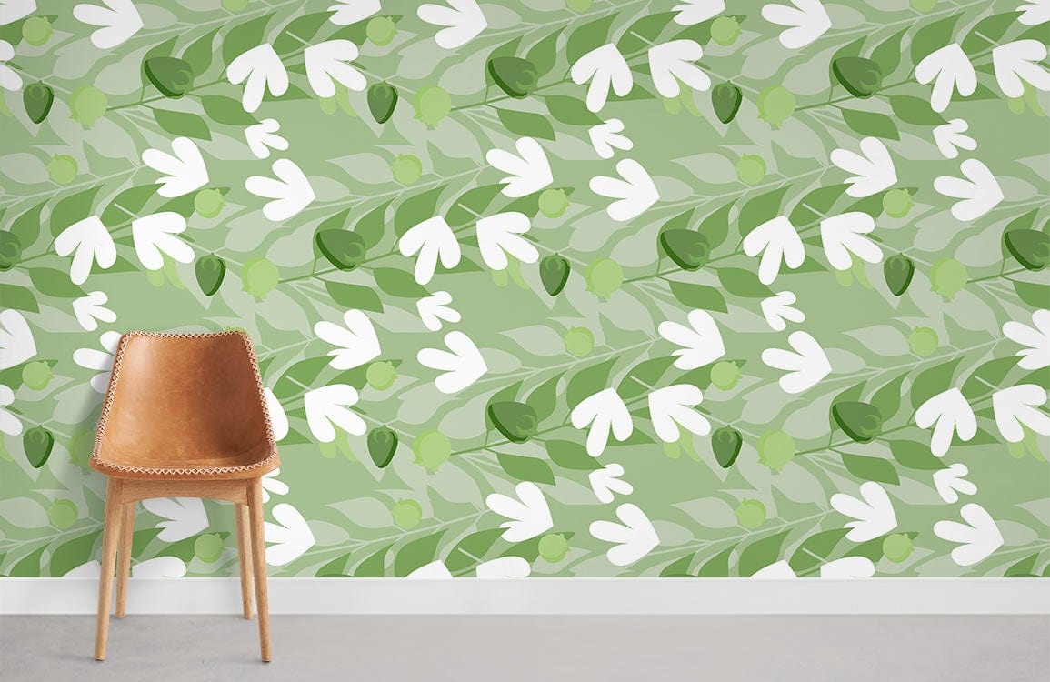 Green floral wallpaper, leafy pattern, modern British home, brown leather chair, laminate flooring.