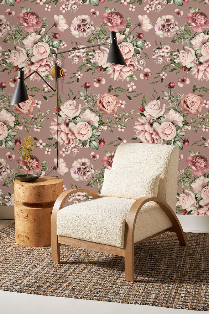 Vintage Blossom wallpaper, soft pink-green tones, armchair, floral mural, modern room decor, elegant design.