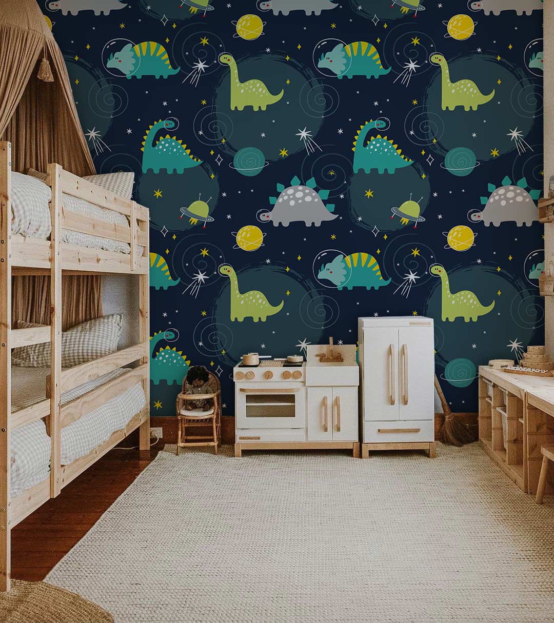 Children's room with dinosaur galaxy wallpaper, wooden bunk beds, play kitchen, and cosy rug flooring.