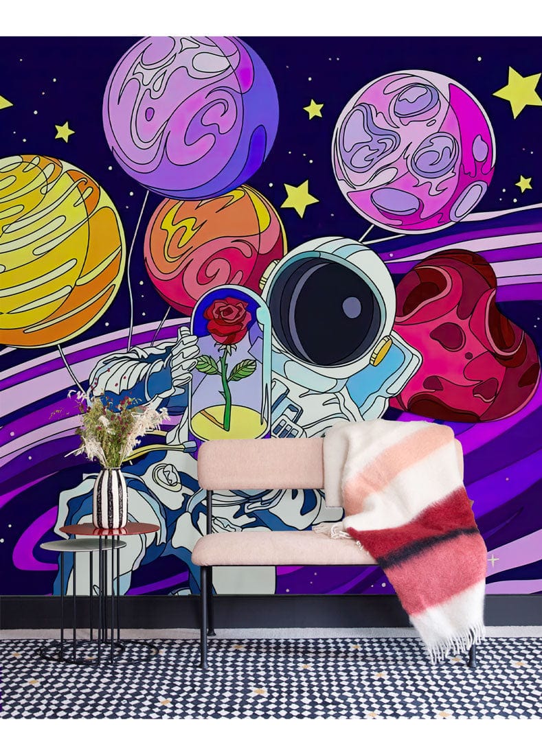 Cosmic Astronaut mural with vibrant planets, colourful seating, monochrome rug, and mid-century modern decor.