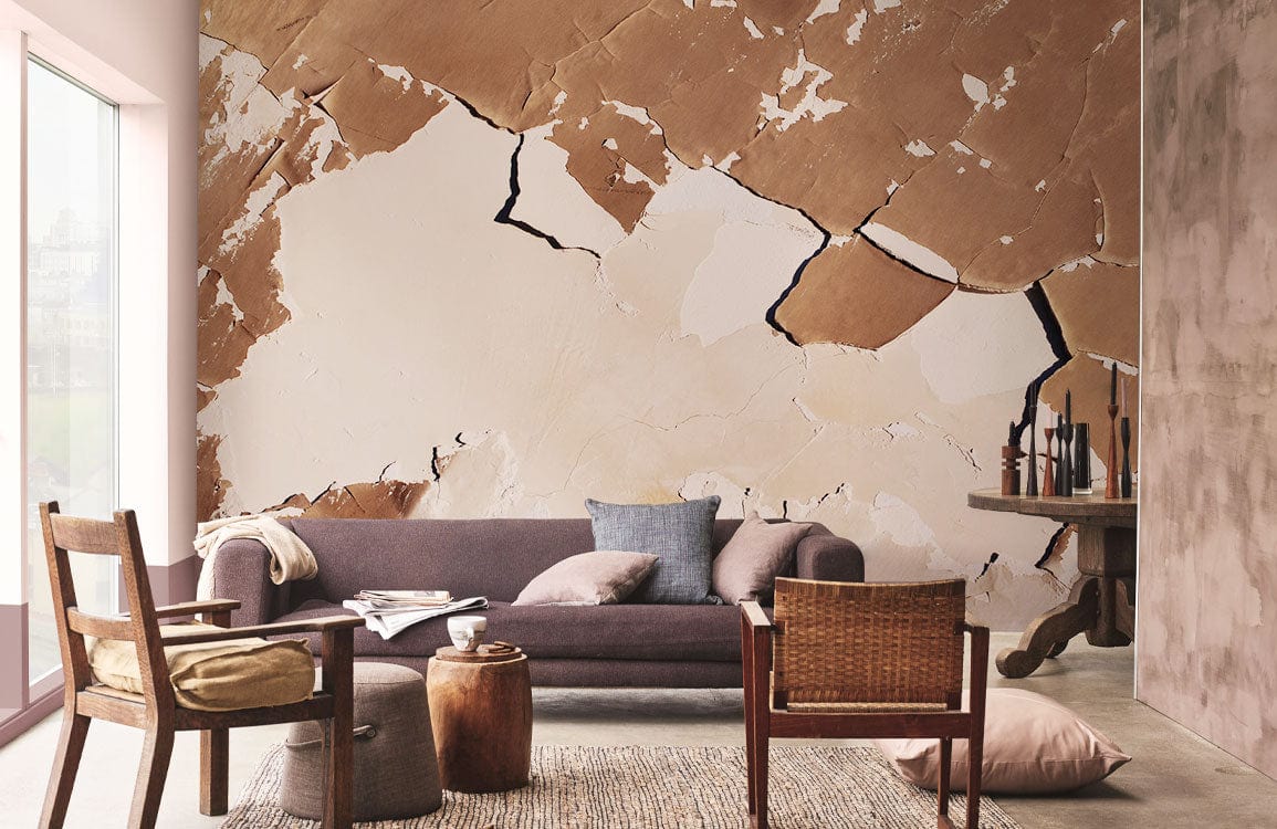 Brown and cream cracked earth mural wallpaper, modern sofa, wooden chairs, natural light, cosy setting.