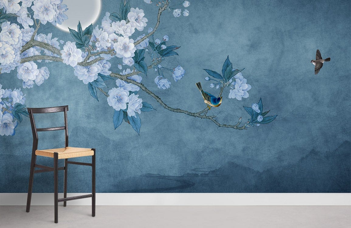 Night Blossom Serenity mural wallpaper featuring blue flowers, birds; wooden chair on concrete flooring.