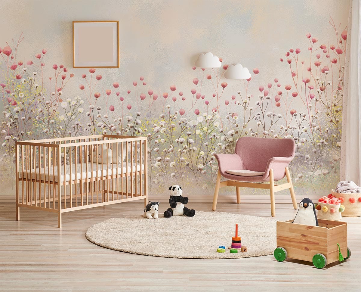Soft pastel floral meadow wallpaper in nursery with pink chair, wooden cot, and light wood flooring.