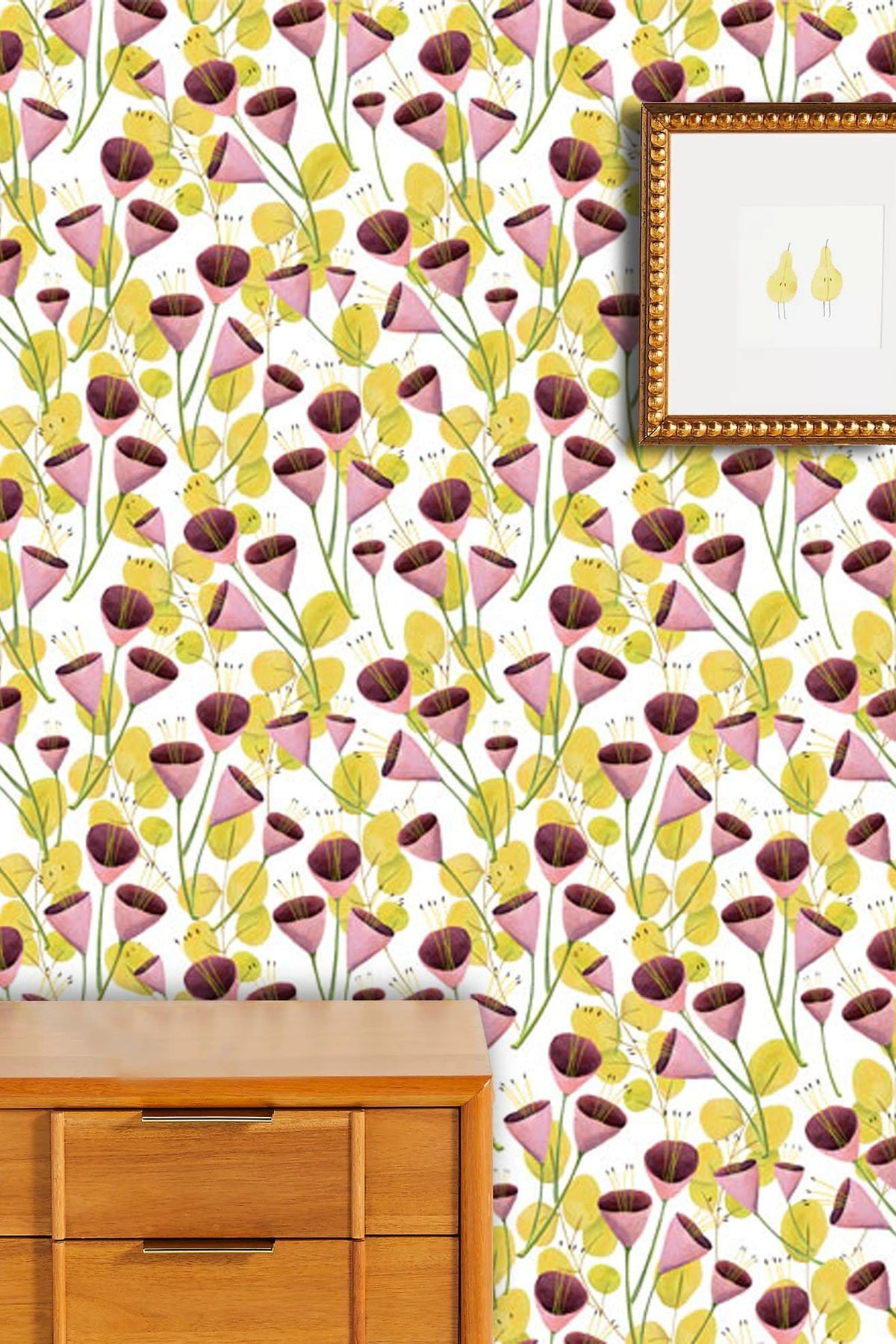 Vintage Floral Bloom Wallpaper featuring pink, yellow, green design; wooden chest; framed artwork on wall.