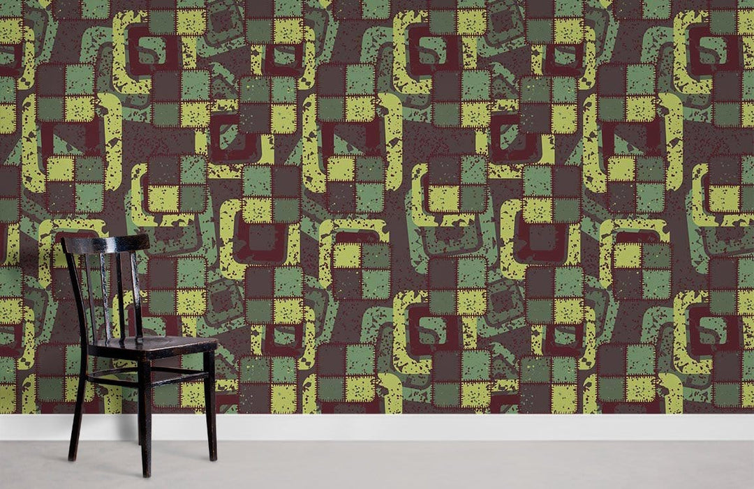Vintage Geometric Abstract Wallpaper in earthy tones, featuring green, brown pattern, black chair, grey floor.
