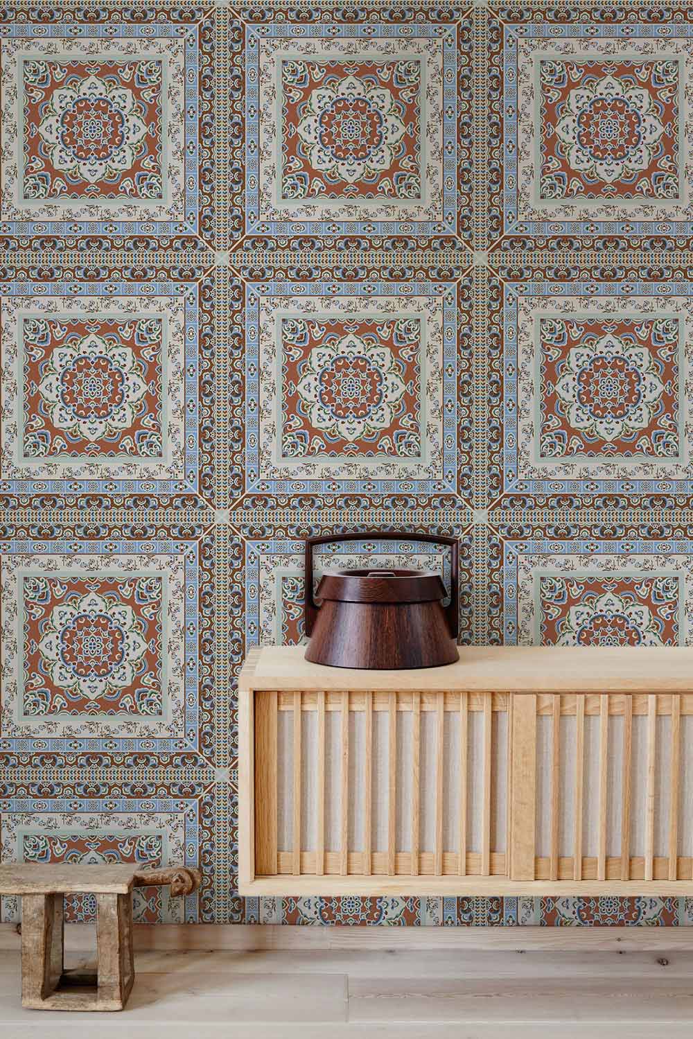 Vintage Moroccan tile pattern wallpaper, earthy tones, intricate design, light wood furniture, decorative item.