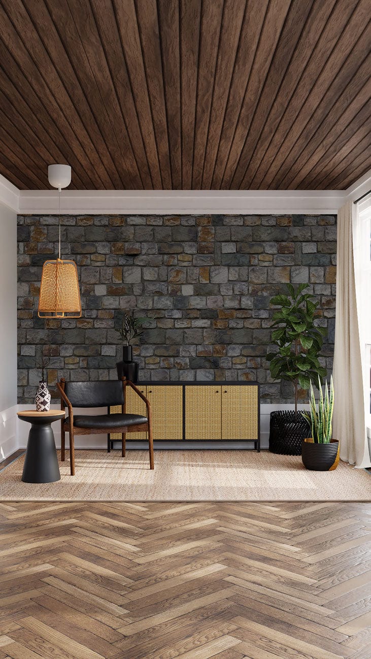 Rustic stone brick wallpaper in lounge, wooden ceiling, herringbone floor, wicker lamp, and Nordic chair.