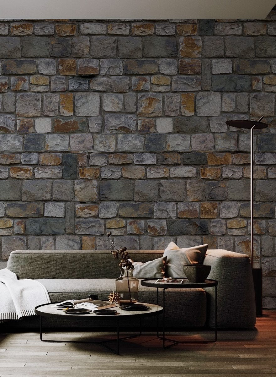 Rustic wallpaper with stone pattern, grey sofa, wooden flooring, modern decor, warm and inviting lounge.