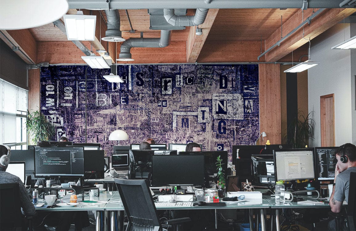 Vintage Purple Urban Text Collage Mural Wallpaper in modern office with wooden beams and industrial lighting.