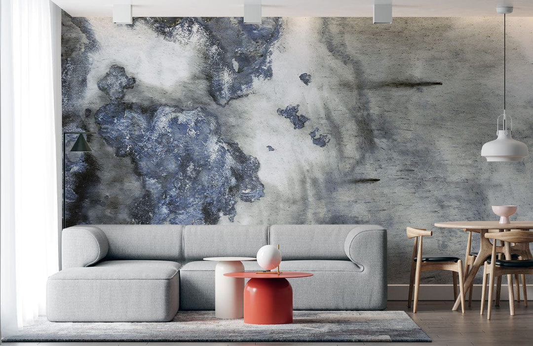 Elegant abstract mural wallpaper in living room with grey sofa, wooden dining set, and pendant lights.