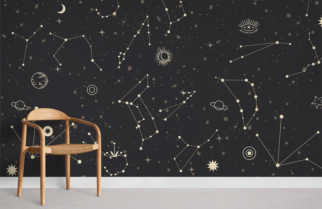 Cosmic Constellations wallpaper mural; starry design with wooden chair on grey flooring in modern room.