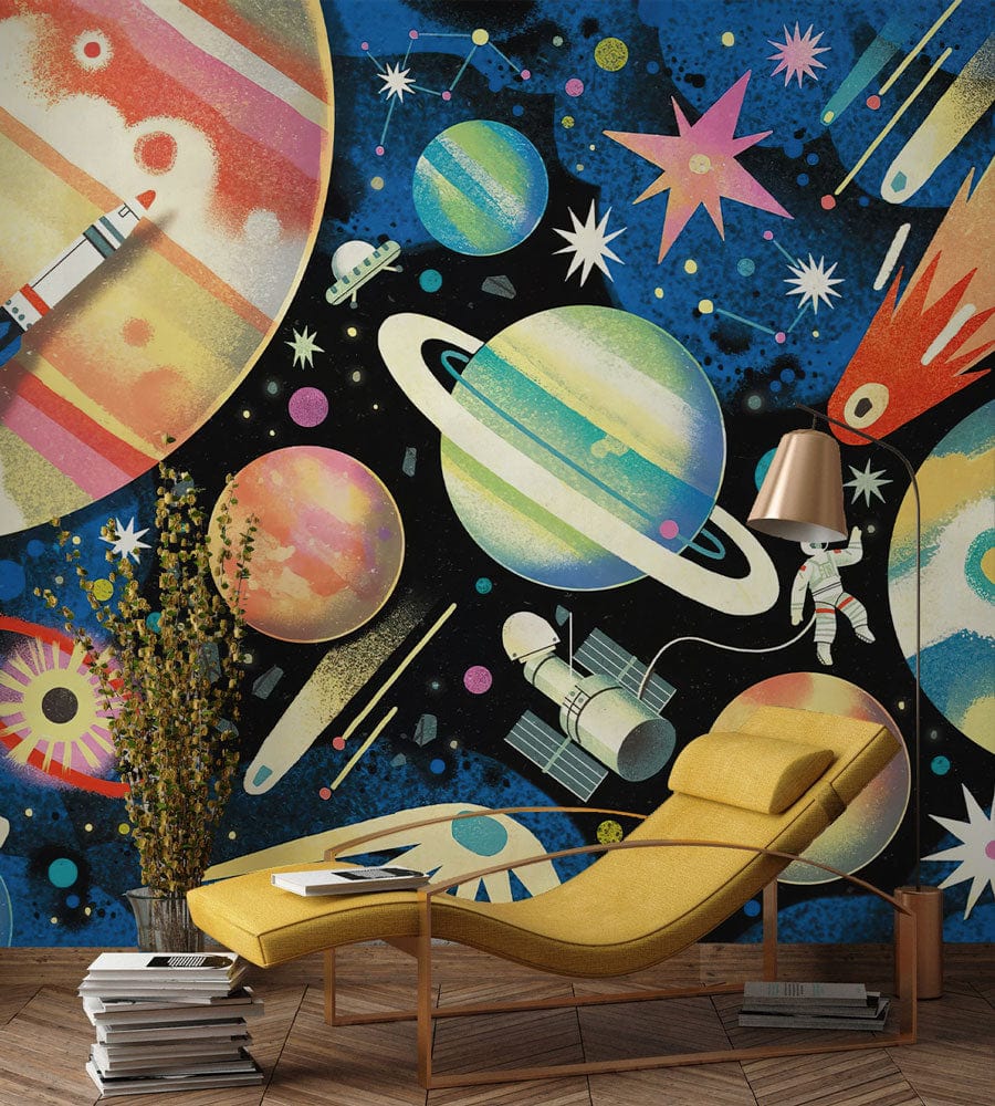 Vibrant cosmic adventure wallpaper in children's room with yellow lounge chair and wooden flooring.