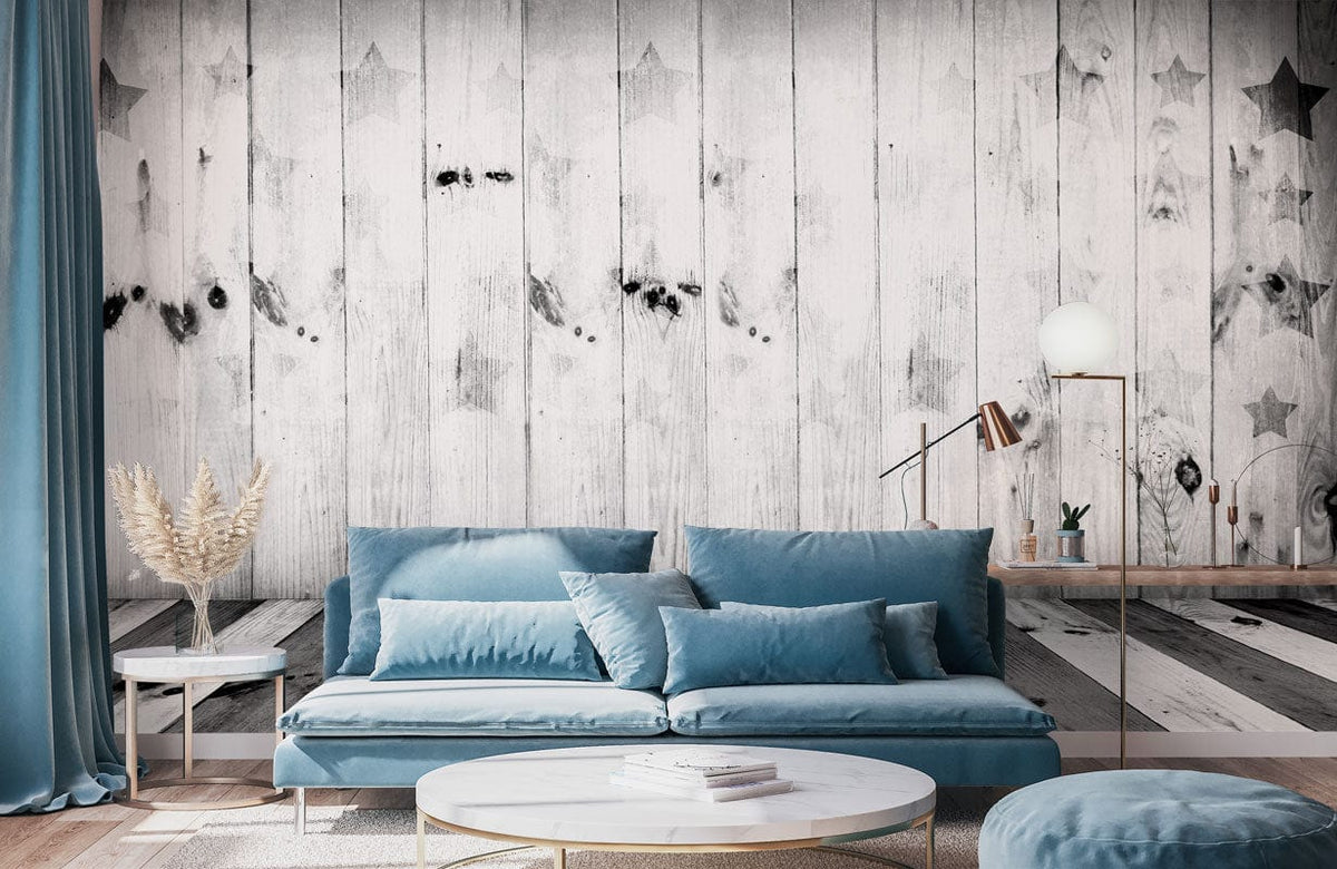 Cosy living room with Rustic Grey Wood Panel Wallpaper, vintage star pattern, and blue sofa decor.