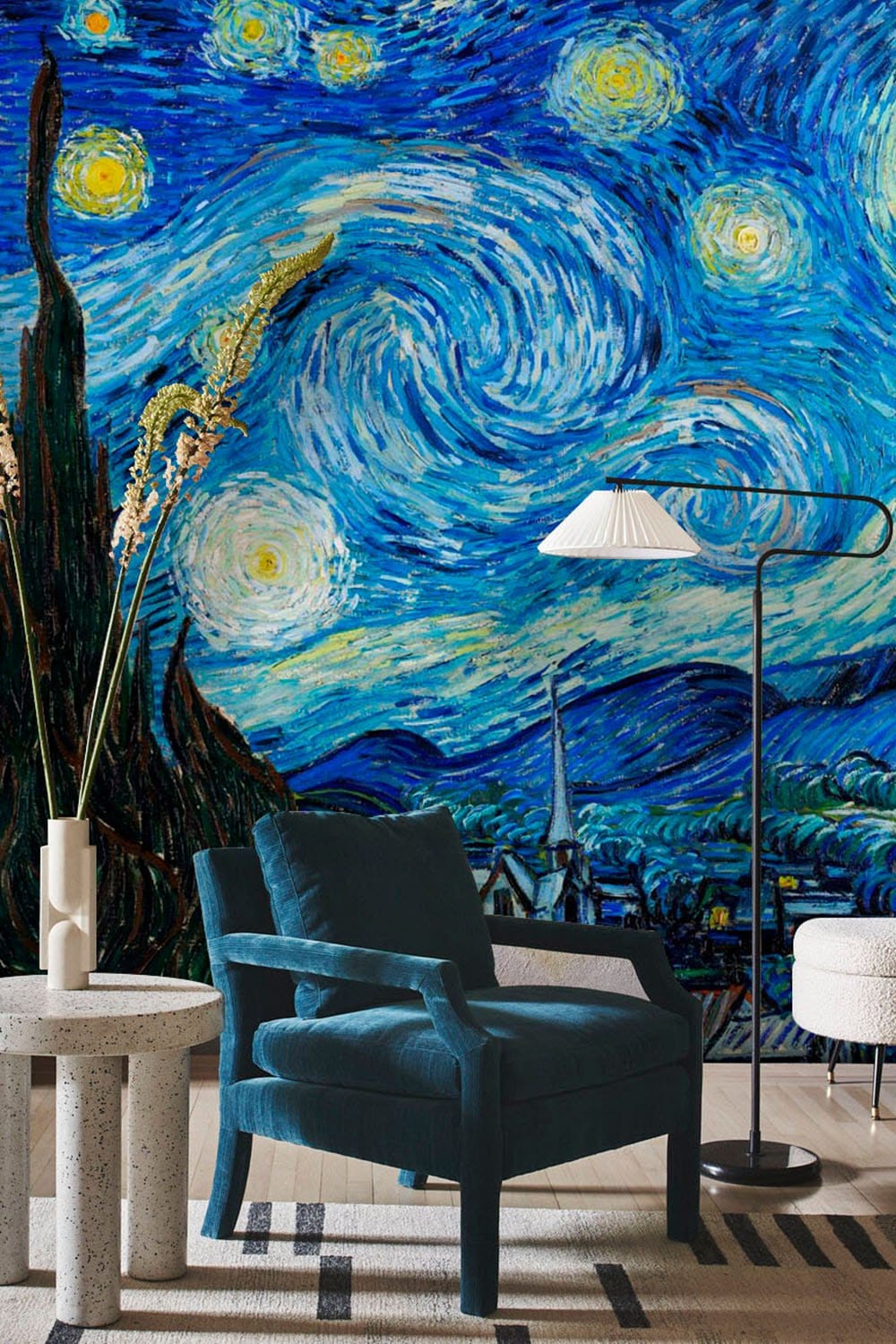 Starry Night Inspired mural wallpaper, blue armchair, modern floor lamp, beige carpet, artistic decor.