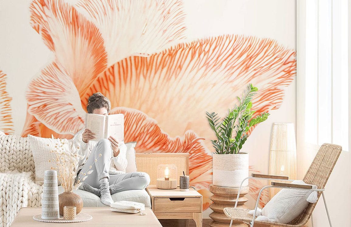 Elegant Peach Floral Blossom Mural Wallpaper in cosy living room with light sofa, wooden table, and chair.