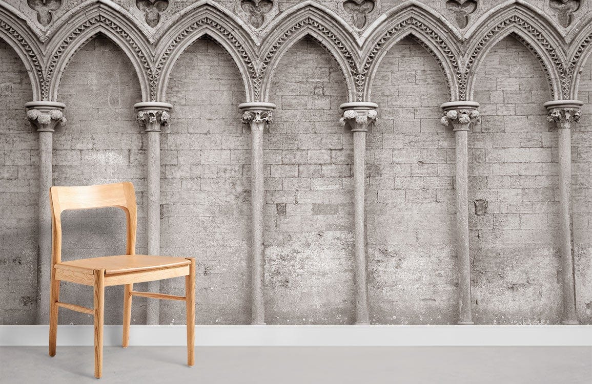 Vintage Gothic Archway Mural Wallpaper, sepia stone design, wooden chair, grey floor in living room.