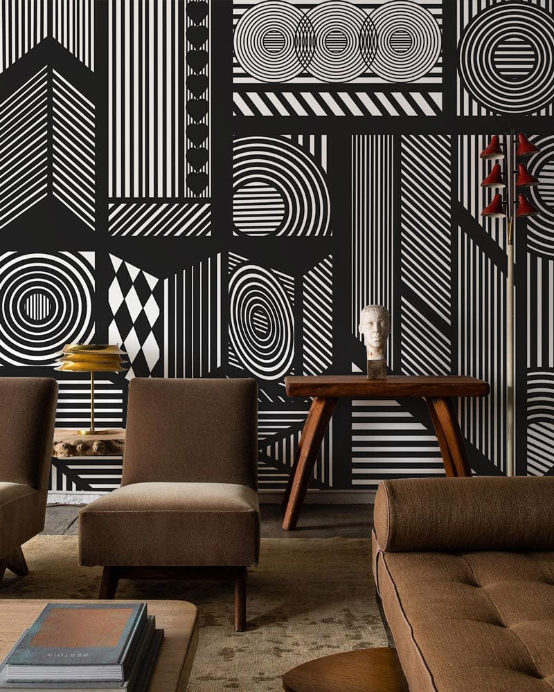Monochrome geometric patterns wallpaper in modern living room with brown sofas and wooden furniture.