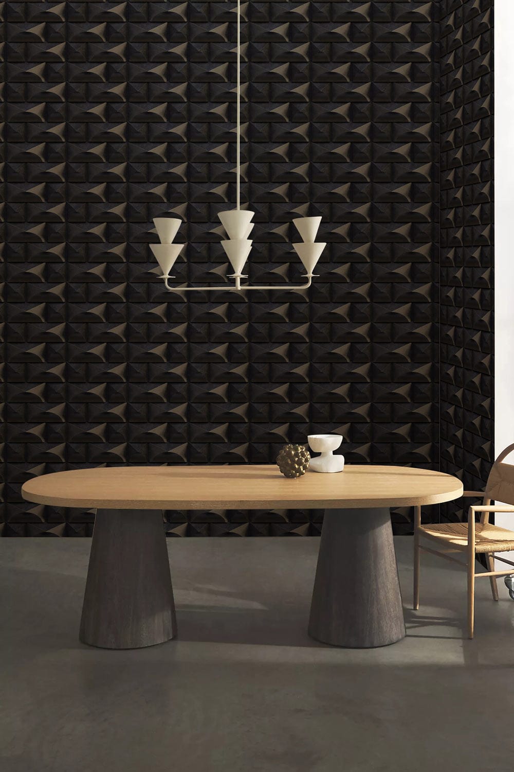 Geometric 3D charcoal wallpaper, modern dining room, wooden table, minimalist chandelier, grey flooring.