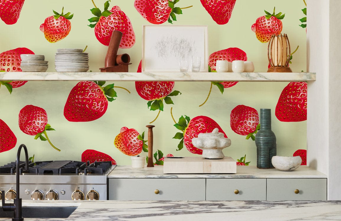 Vibrant strawberry-patterned wallpaper, kitchen setting, grey cabinets, marble countertop, decorative vases, modern decor.