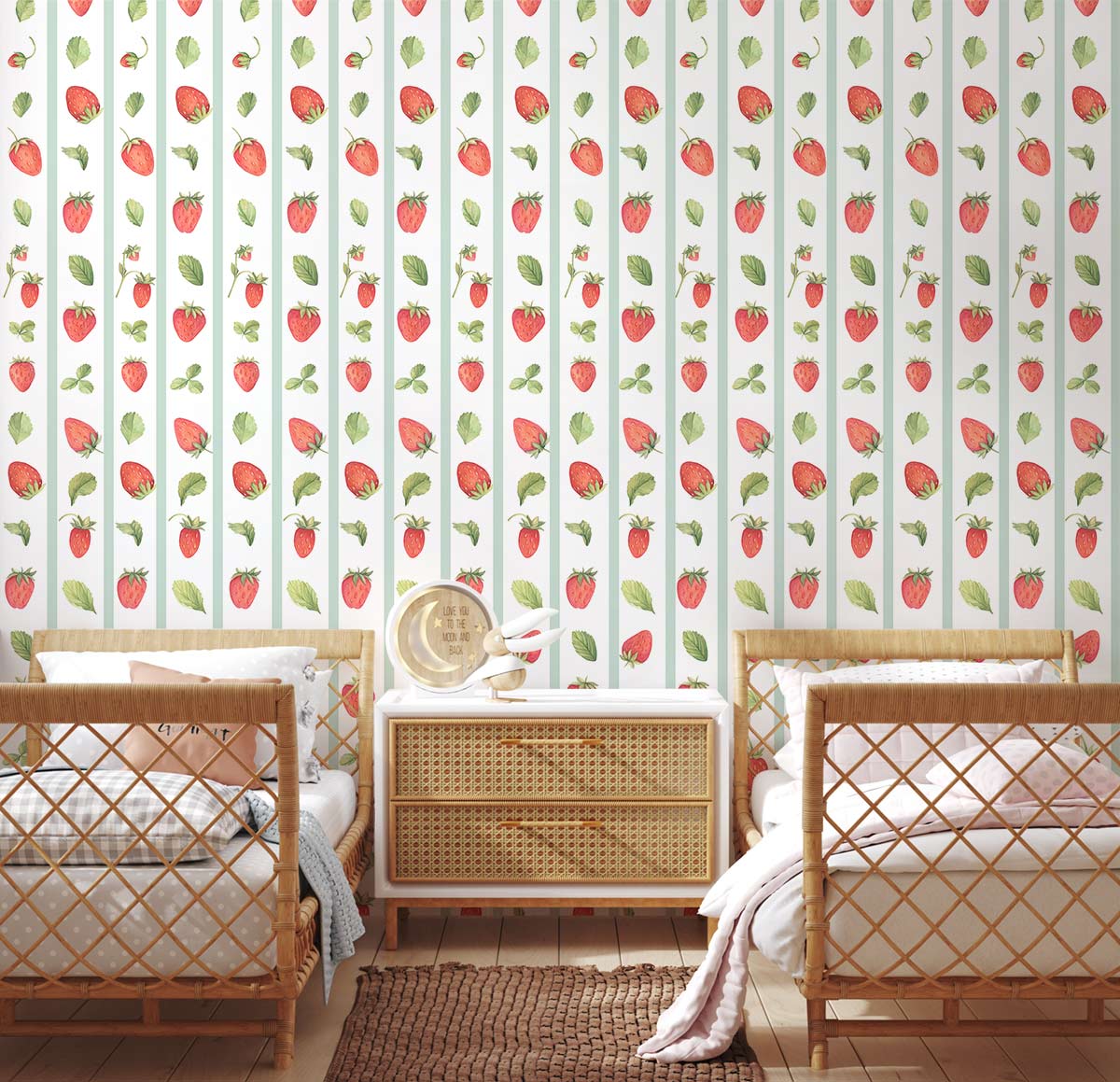 Charming strawberry wallpaper in a pastel-themed bedroom with wicker beds, wooden furniture, and flooring.