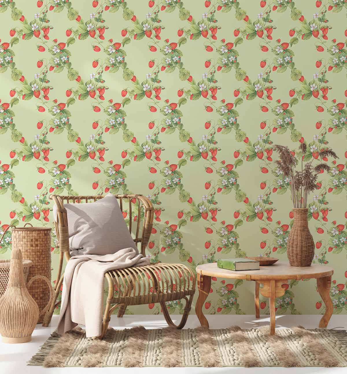 Vintage green strawberry floral wallpaper, classic rattan chair, rustic wooden table, cosy neutral rug.