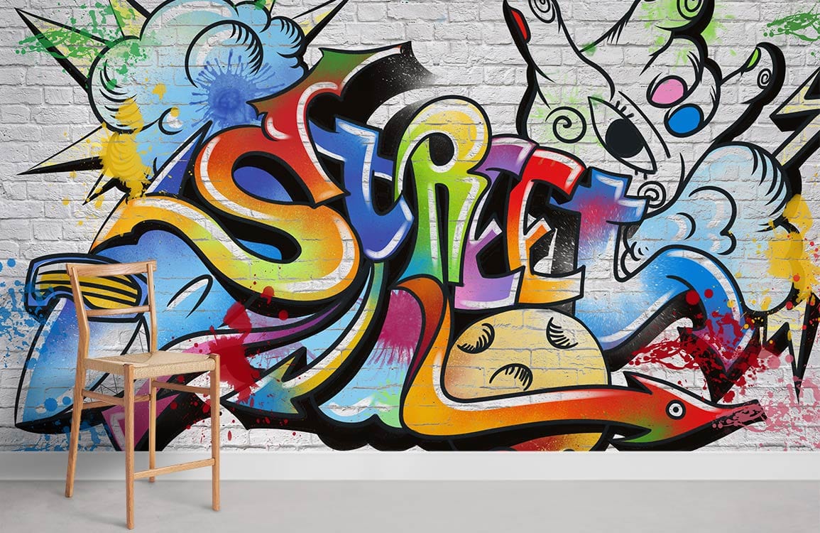 Colourful 'Urban Graffiti Vibes' mural wallpaper, vibrant design, white brick, modern wooden chair, interior.